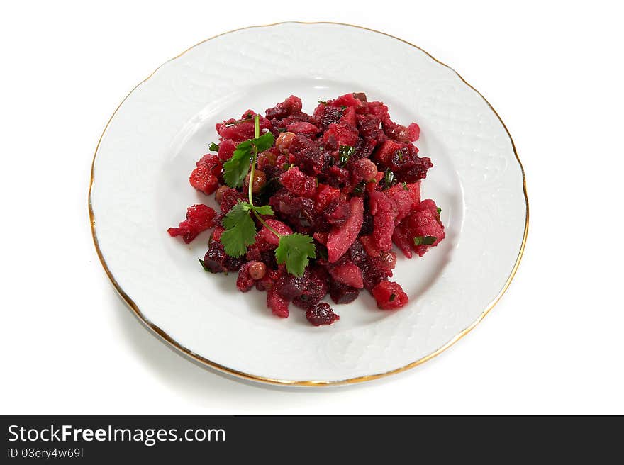 Russian salad Vinaigrette of potatoes, beets, carrots, peas and pickled cucumber isolated on white background. Russian salad Vinaigrette of potatoes, beets, carrots, peas and pickled cucumber isolated on white background