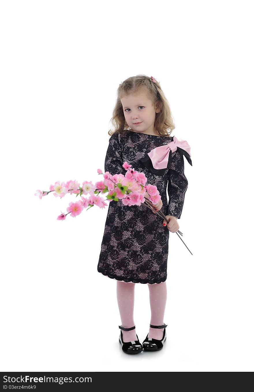 Pretty little girl in black elegant party dress with flowers. isolated. Pretty little girl in black elegant party dress with flowers. isolated