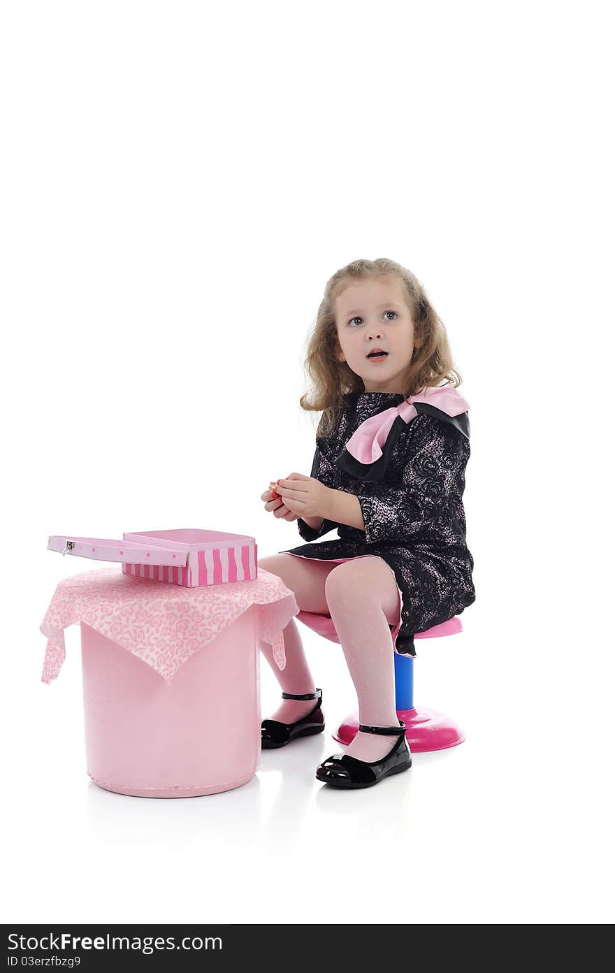 Pretty little girl in black elegant dress on children party playing. isolated. Pretty little girl in black elegant dress on children party playing. isolated