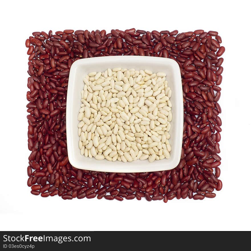 White beans in a dish on kidney beans square isolated on white