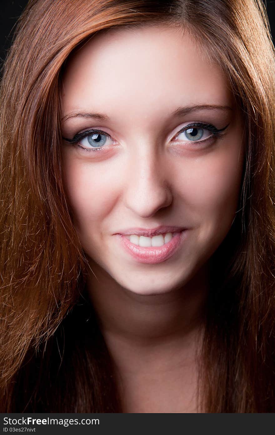 Close-up portrait face of beautiful smiling girl. Studio shot