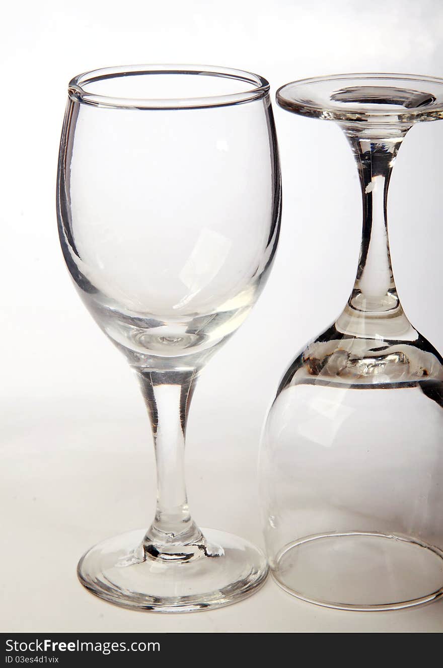 Two glasses on a white surface.