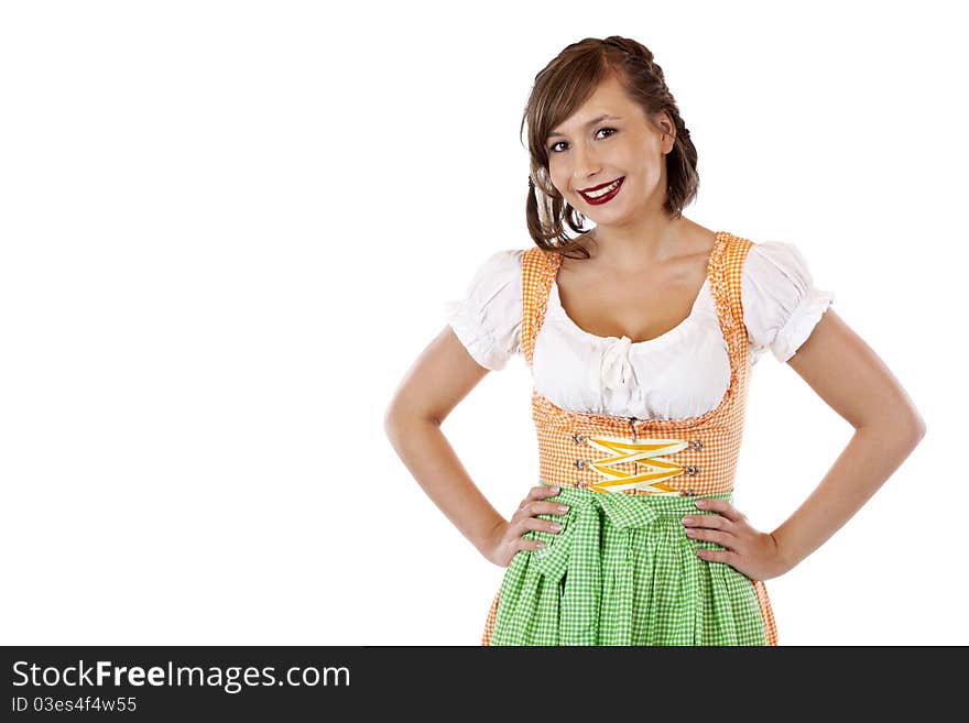 Young, self-confident, Bavarian woman in Oktoberfest dirndl cloth.Isolated on white background. Young, self-confident, Bavarian woman in Oktoberfest dirndl cloth.Isolated on white background.