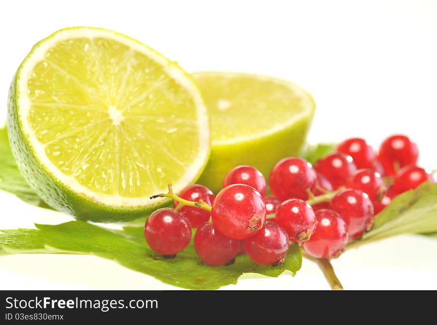 Red currant and lemon isolated in studio. Red currant and lemon isolated in studio