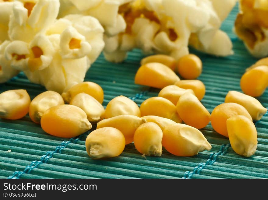 Corn and fresh fried popcorn. Corn and fresh fried popcorn