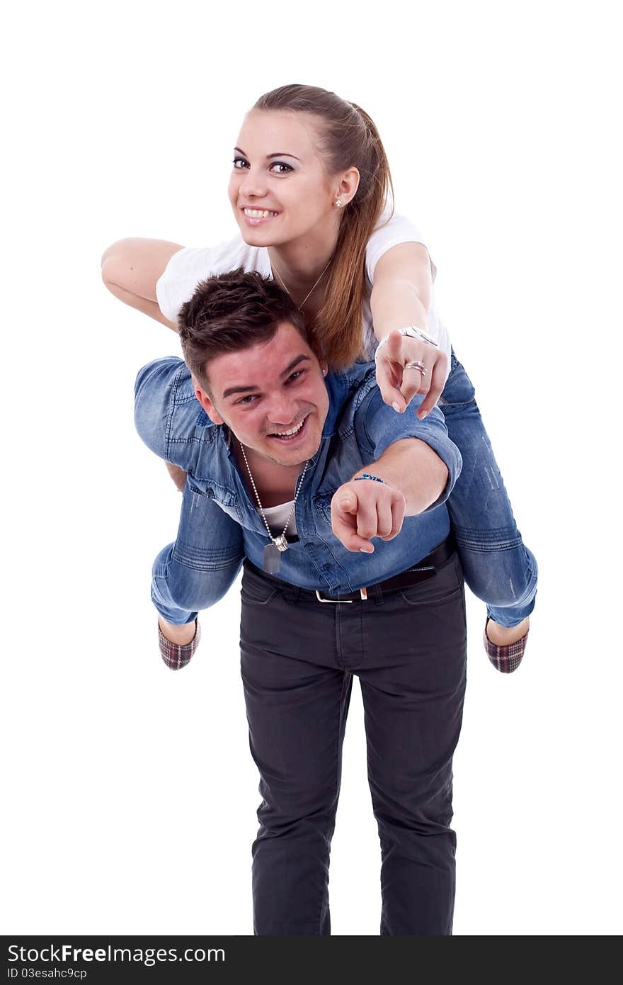 Young man carrying his cute girl on back. woman and pointing to you