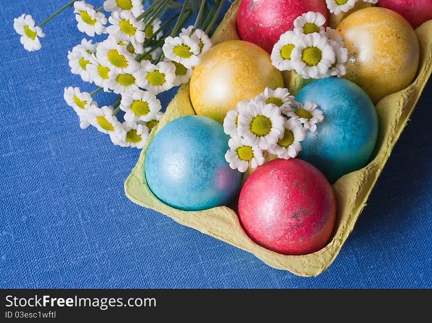 Easter eggs in box is decorated with flowers. Easter eggs in box is decorated with flowers.