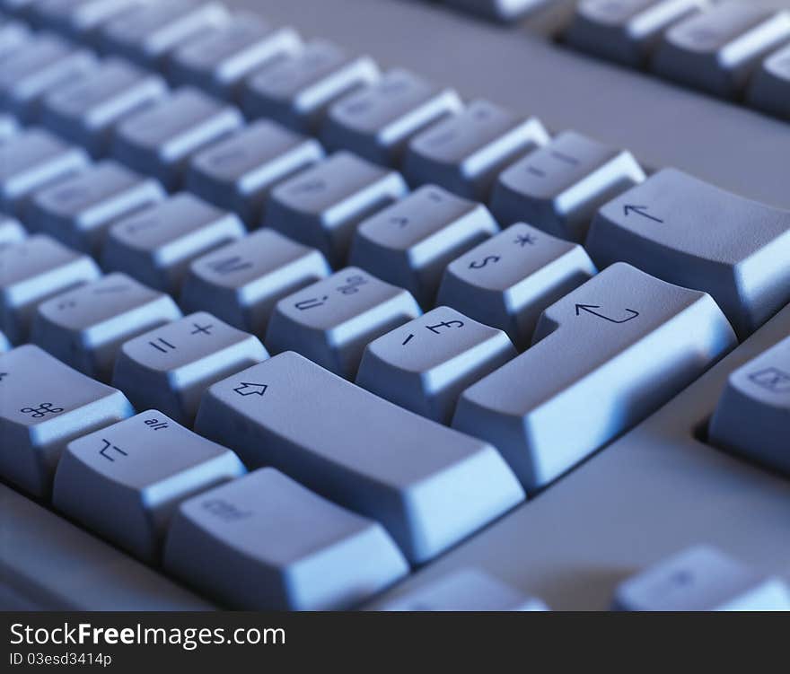 Computer keyboard close-up. Focused on 'Enter' key