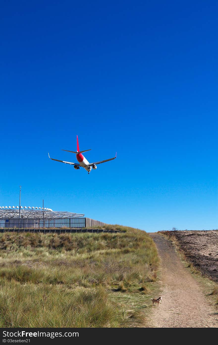 Low airplane coming in to land over Seven Mile Beach, Tasmania. Low airplane coming in to land over Seven Mile Beach, Tasmania.