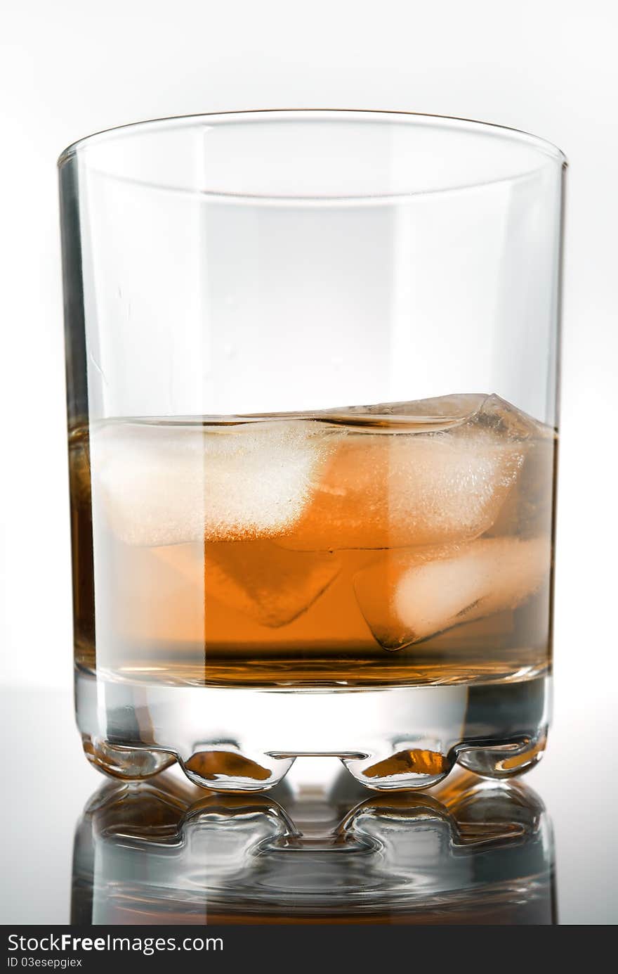 Glass of whisky with ice. Glass of whisky with ice