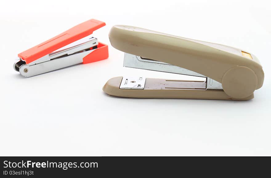 Two staplers isolated on a white background