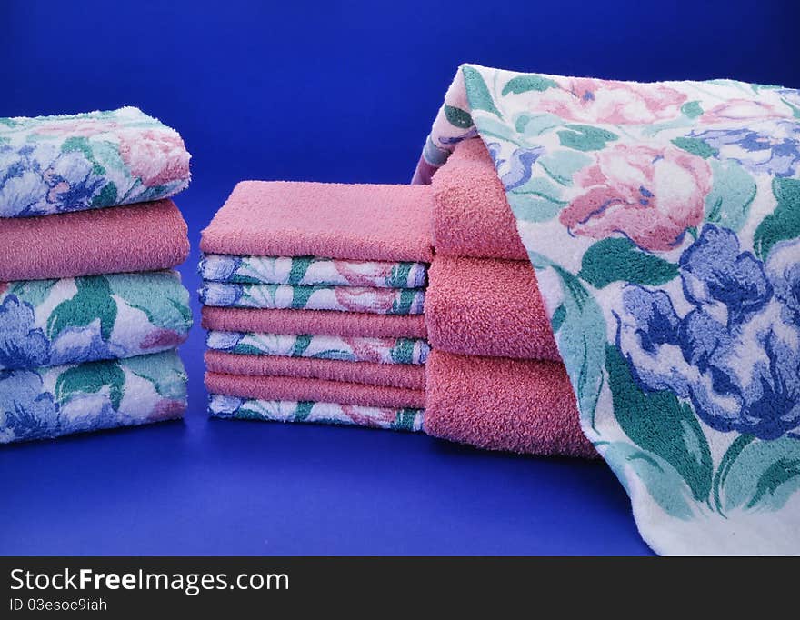 Pink and blue towel set on blue background