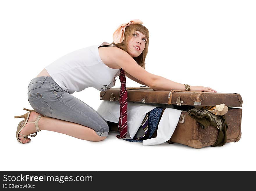 Housewife packing old suitcase for her husband's business trip. Housewife packing old suitcase for her husband's business trip