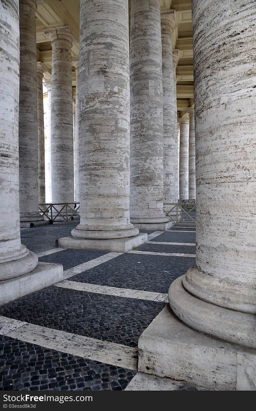 Detail from the 4 rows of columns which make up the welcoming arms of the St Peter's Square colonnade, Rome, Italy. Piazza del Pietro. Detail from the 4 rows of columns which make up the welcoming arms of the St Peter's Square colonnade, Rome, Italy. Piazza del Pietro.