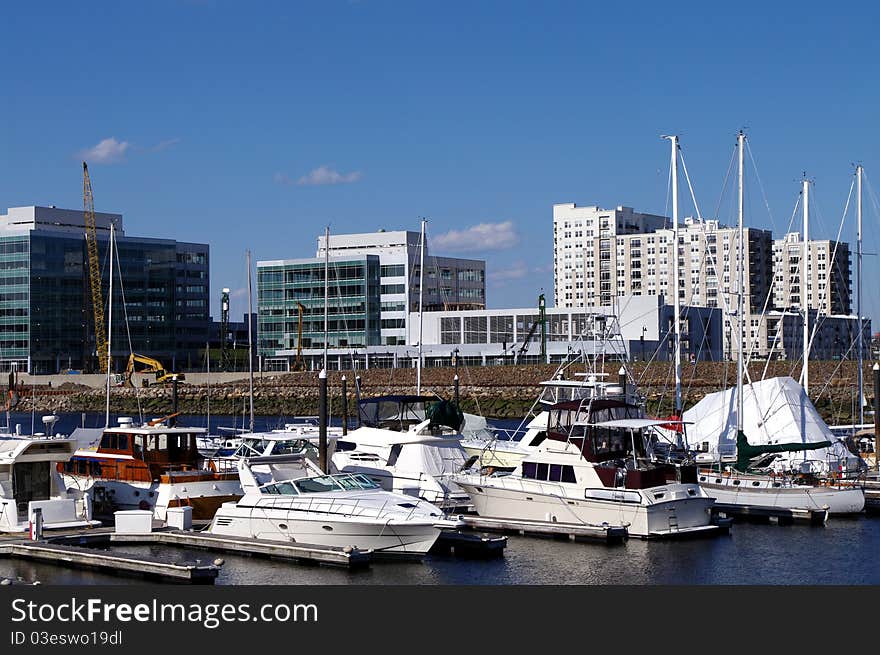 Boats Docked With a Construction Site in the Background