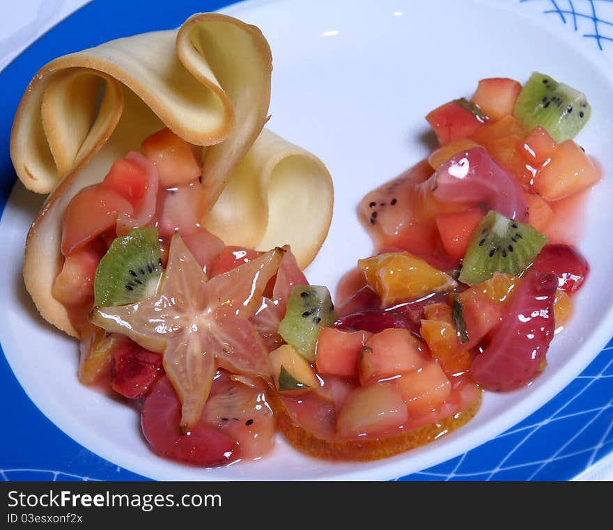 Fruit and berry salad: kiwis, grapes, apples and strawberry. Fruit and berry salad: kiwis, grapes, apples and strawberry