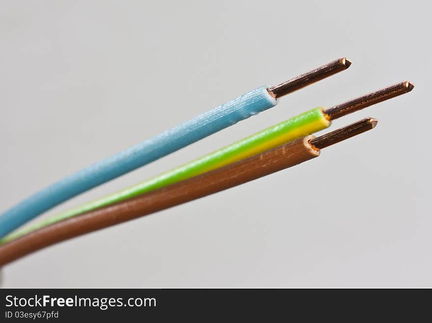 Closeup of three wires of an isolated power cable