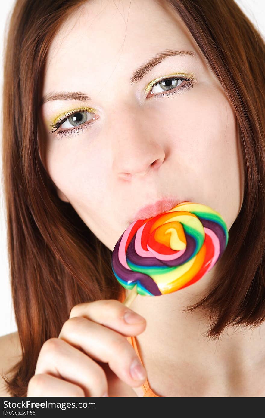 Young Brunette Girl  Eating Big Lollipop