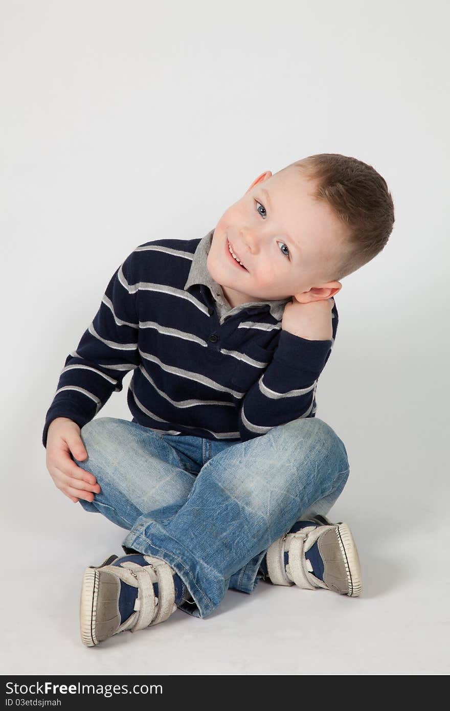 The happy boy listens to someone with a great interest, participating in game