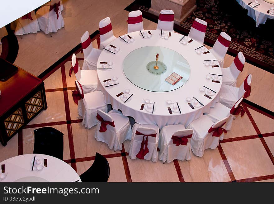 A top view of a round table in a restaurant with 15 seats. A top view of a round table in a restaurant with 15 seats.