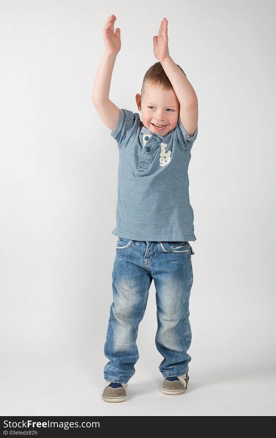 The happy boy listens to someone with a great interest, participating in game. The happy boy listens to someone with a great interest, participating in game