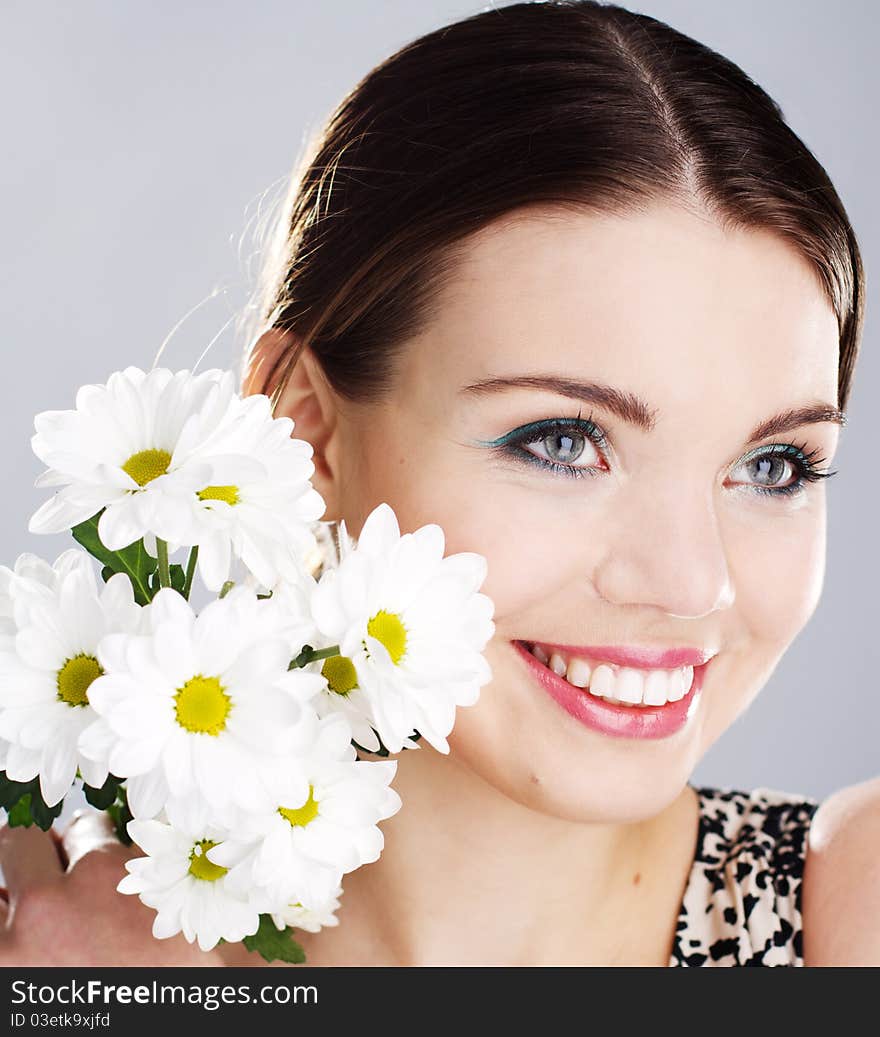 Portrait of a beautiful happy woman with white flowers. Portrait of a beautiful happy woman with white flowers