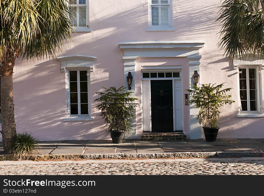 Front of an old southern luxury townhouse on a cobblestone street.  Charleston, South Carolina. Front of an old southern luxury townhouse on a cobblestone street.  Charleston, South Carolina.