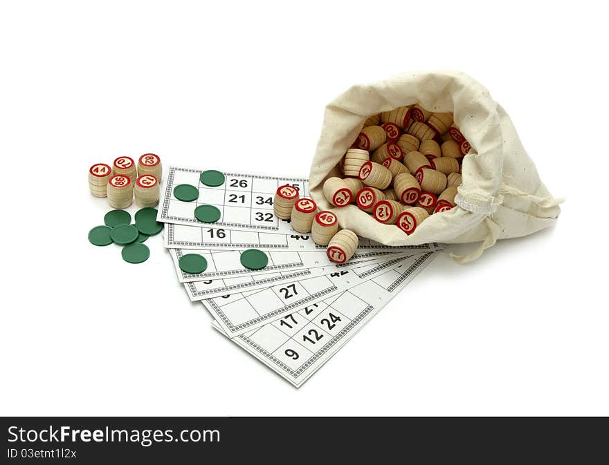 Lotto game: wooden kegs in a sack and game cards isolated on white background