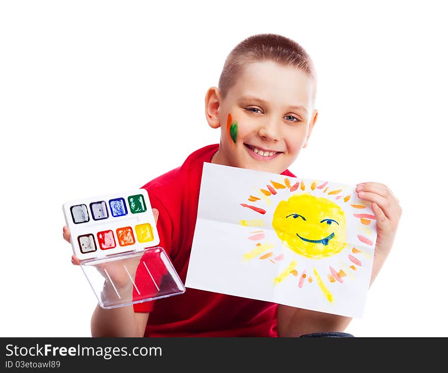 Cute ten year old boy with a watercolor picture of the sun. Cute ten year old boy with a watercolor picture of the sun