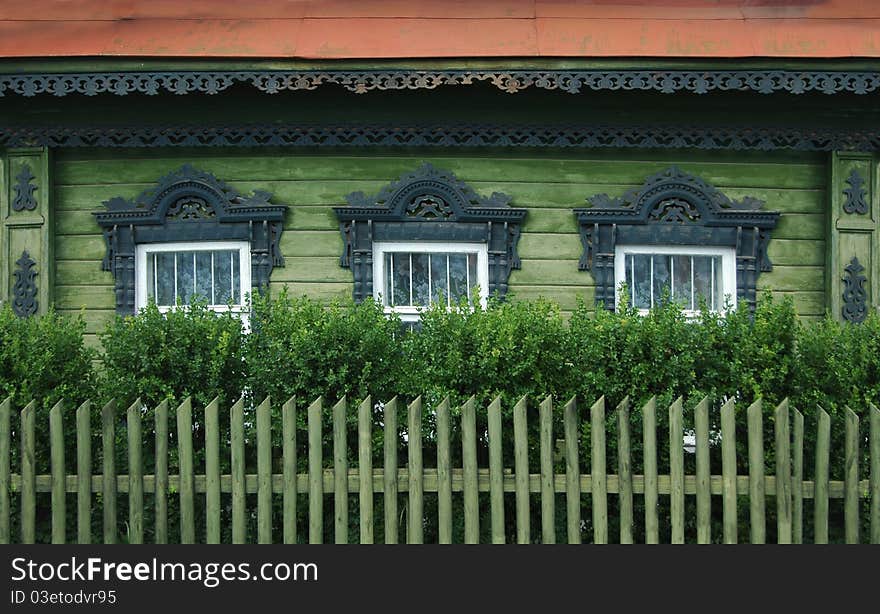 Windows of a old russian house with decorative carvings