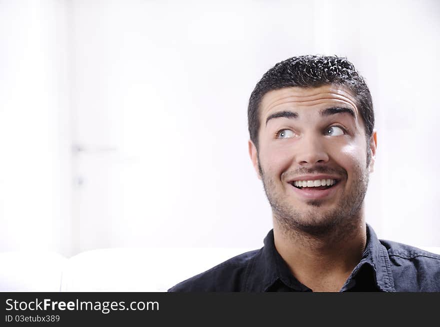 Young man looking with amazement and surprise