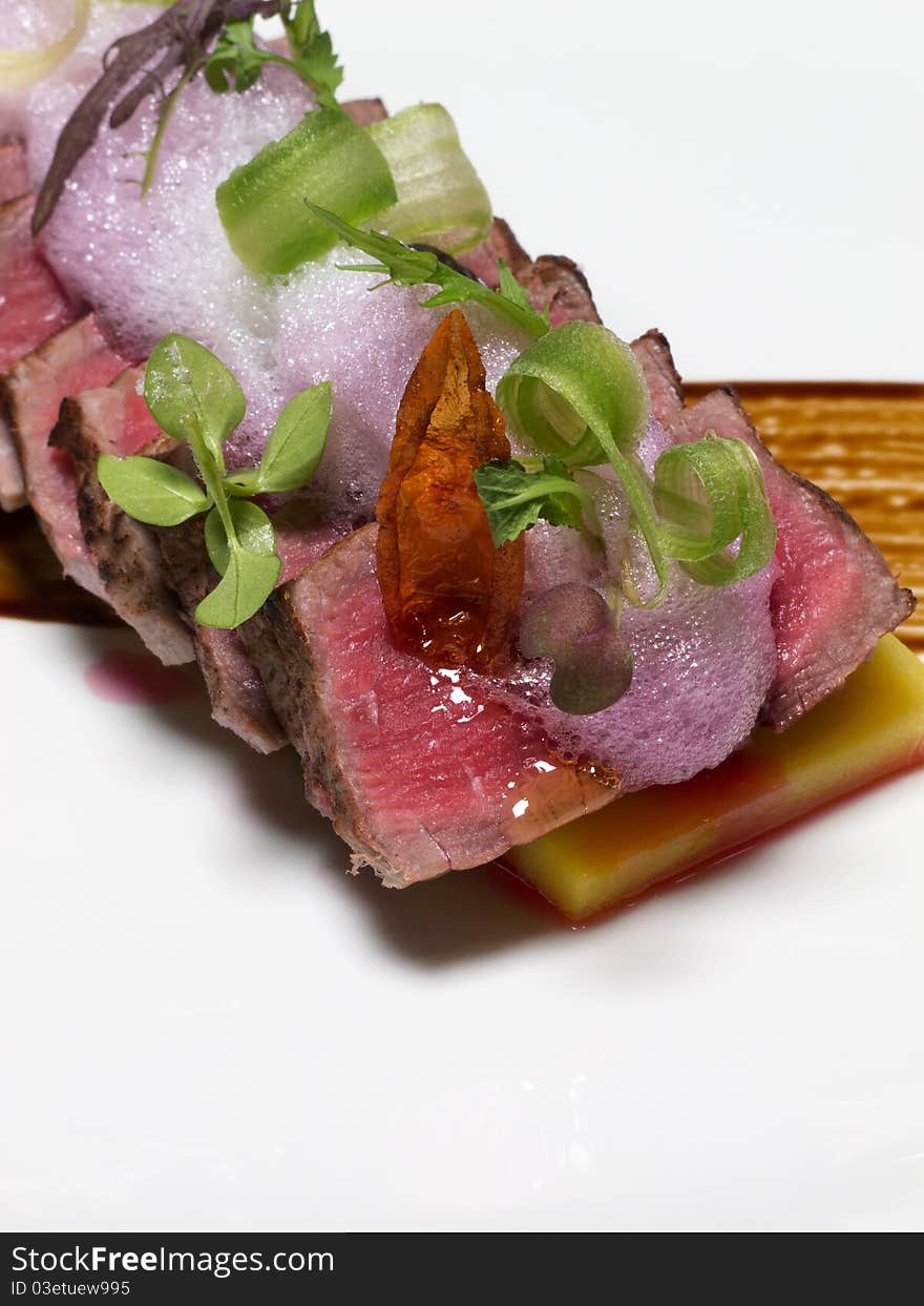 Slices of beef fillet with wine sauce