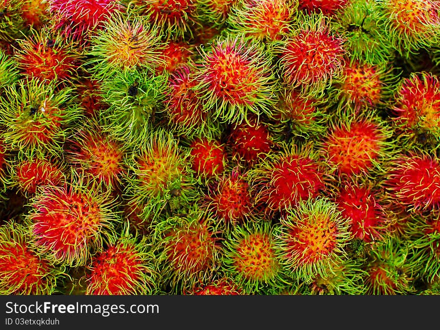 Fresh rambutans in market , closeup background, Asia , Thailand