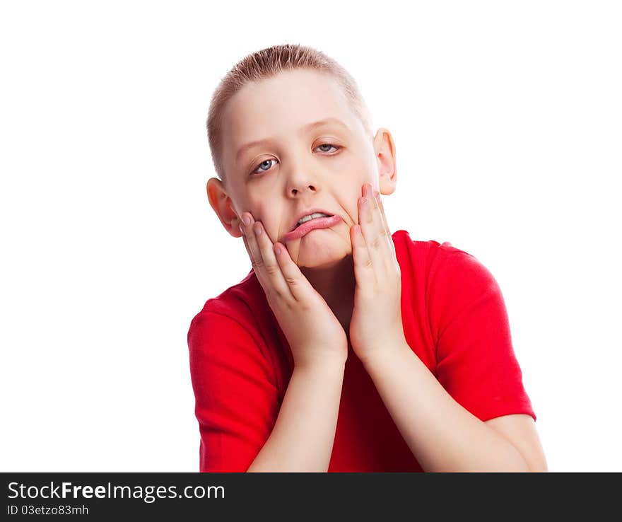 Happy ten year old boy making faces, isolated against white. Happy ten year old boy making faces, isolated against white