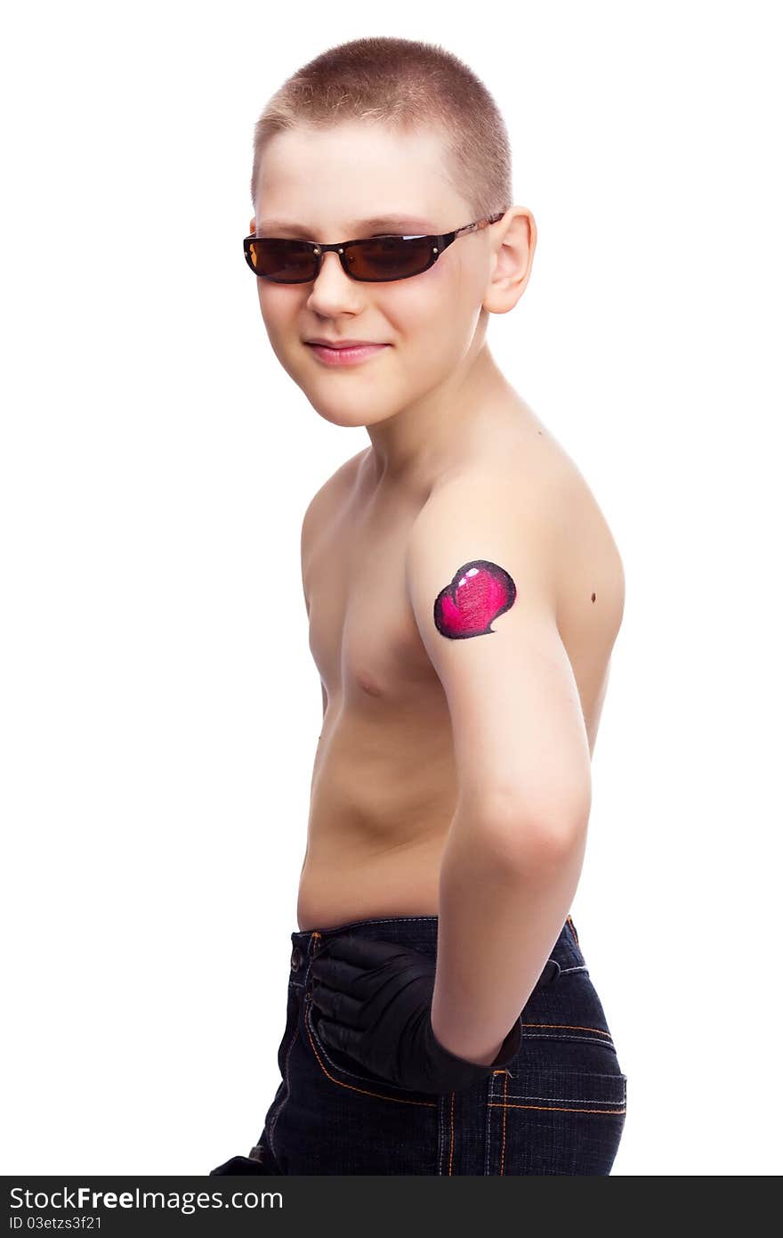 Ten year old boy with a tattoo of a heart on the arm