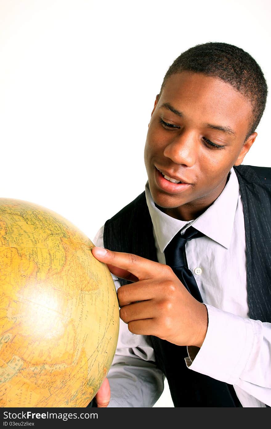 A smiling young man holding a globe. A smiling young man holding a globe