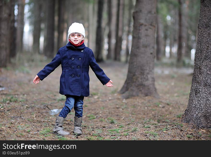 Cute Little Girl Has Fun In Spring Forest