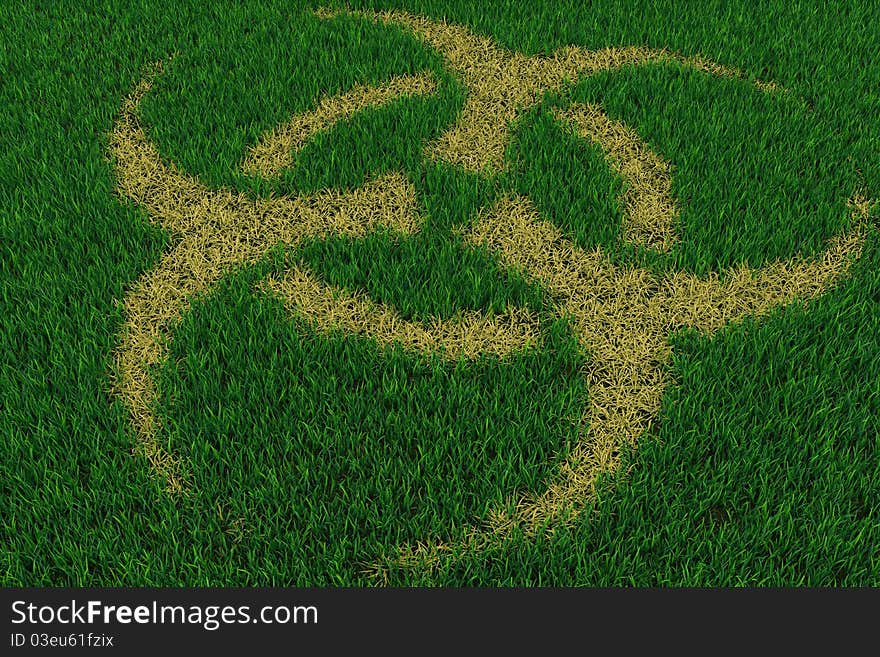 Biohazard symbol from thatch on green grass