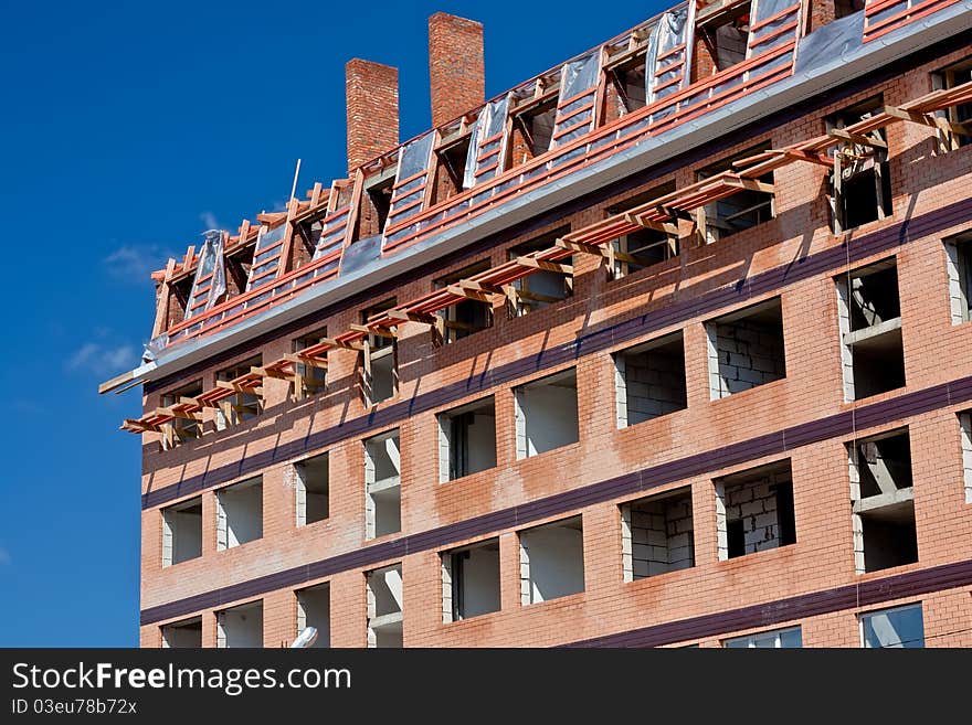 Construction of new brick high-rise building. Construction of new brick high-rise building