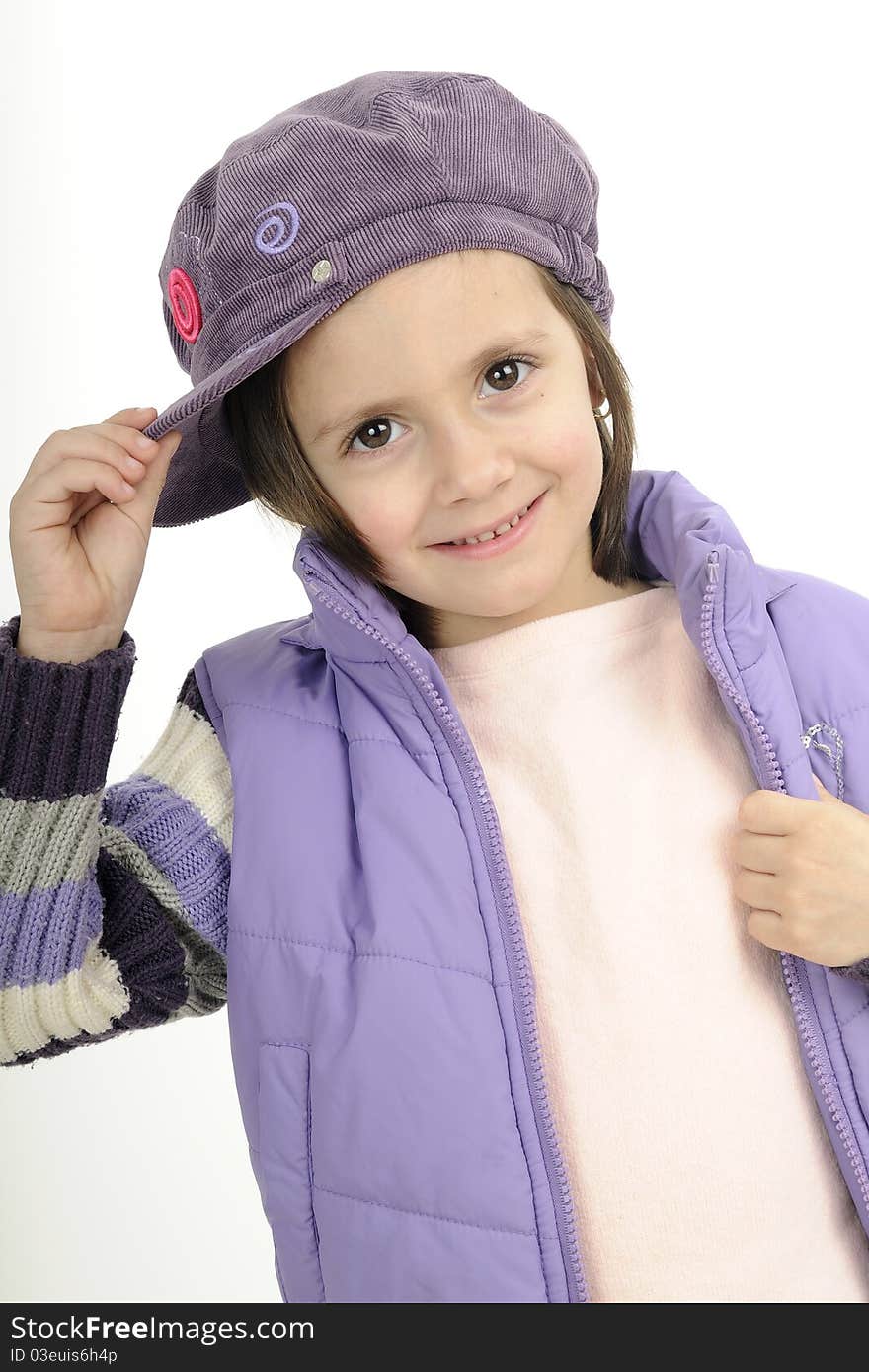 Young fashion model posing with purple cap and jacket. Young fashion model posing with purple cap and jacket