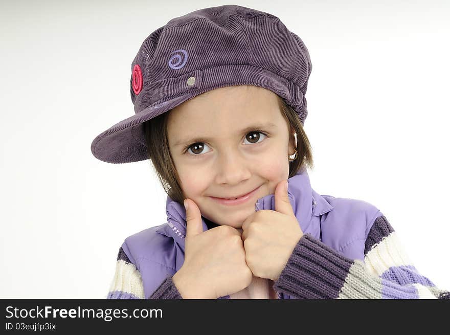 Funny girl posing with purple cap and jacket. Funny girl posing with purple cap and jacket