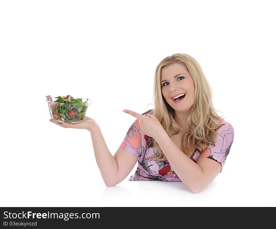 Pretty woman eating green vegetable salad. isolated on white