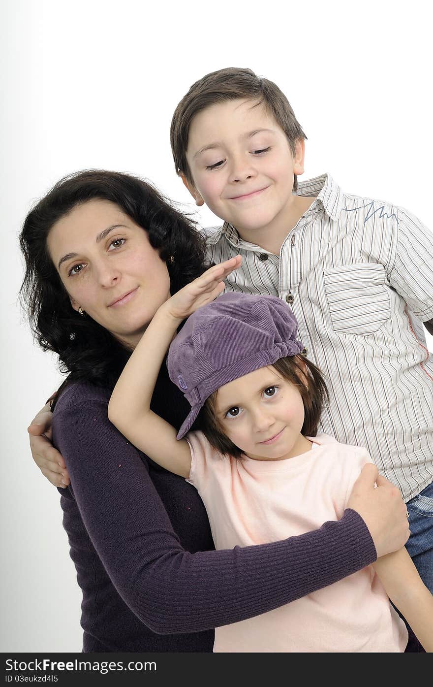 Beautiful mother and her children posing in studio. Beautiful mother and her children posing in studio