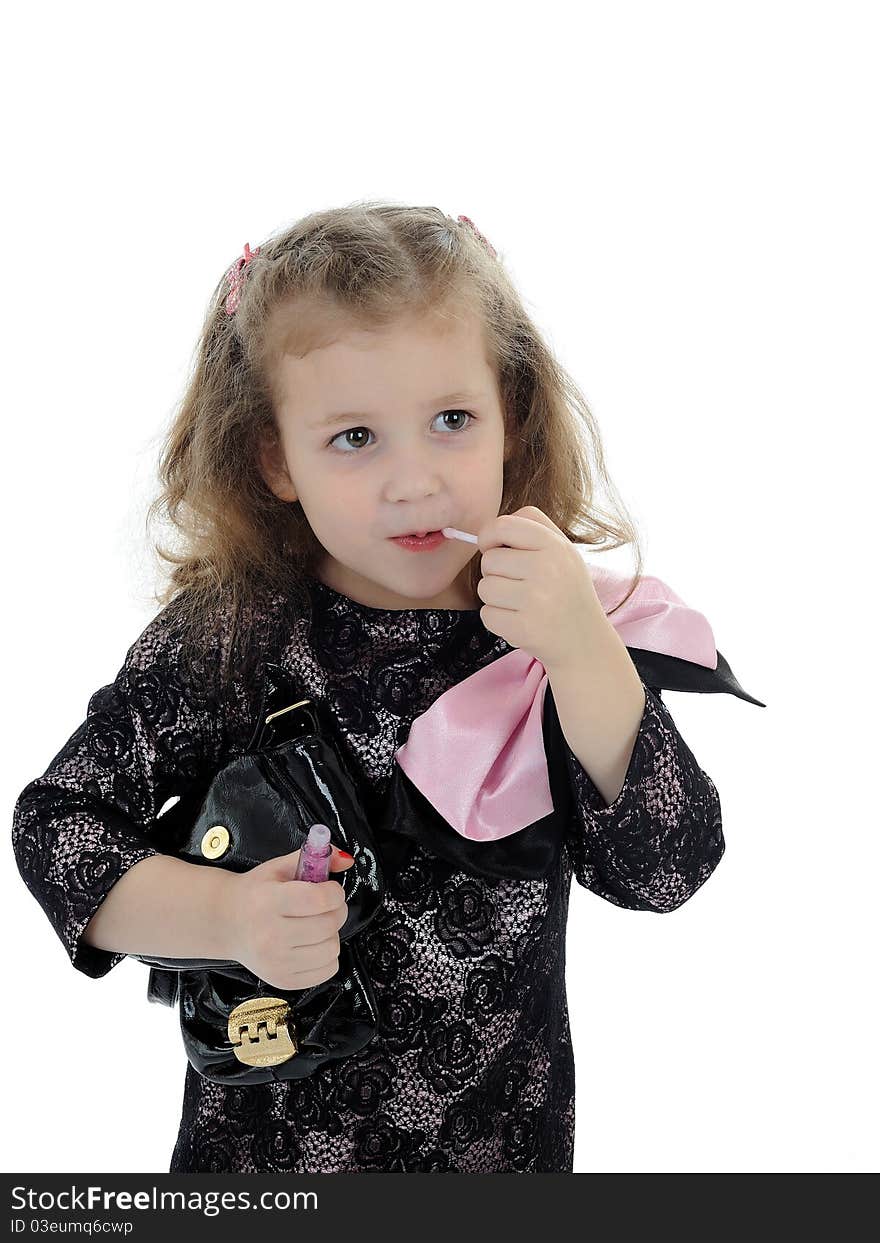 Pretty little girl with child lipstick. isolated on white