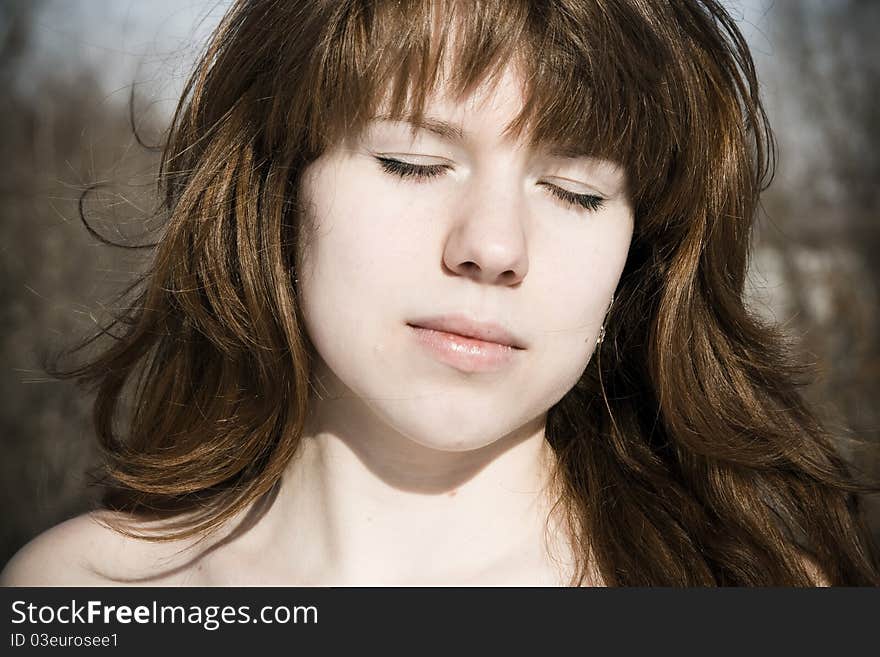 Young woman with closed eye