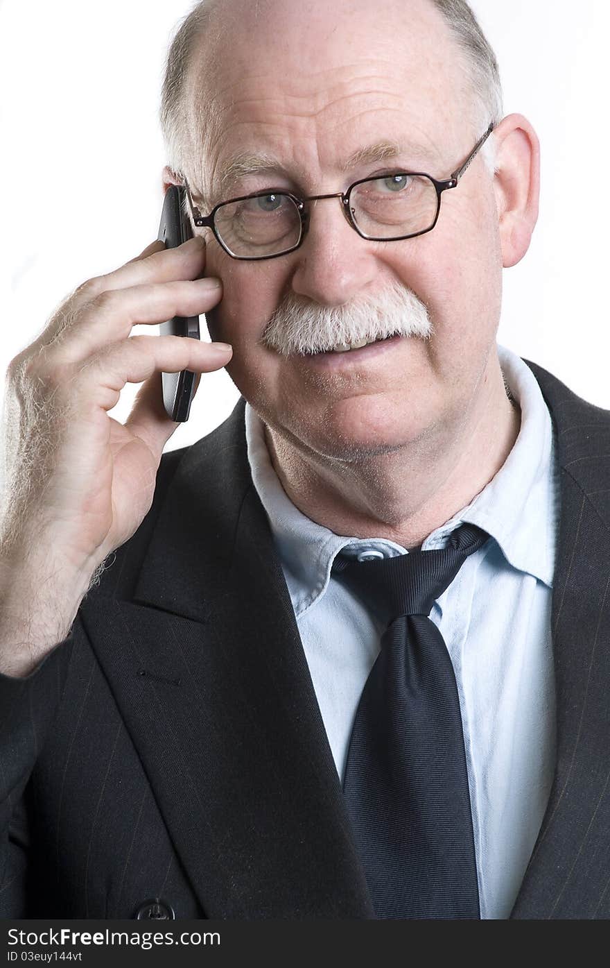 Businessman with his cellphone isolated on white