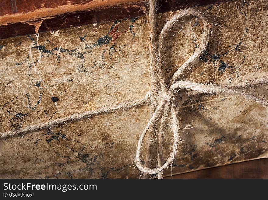 Archival book in a book-depository are tied up by a cord. Archival book in a book-depository are tied up by a cord.