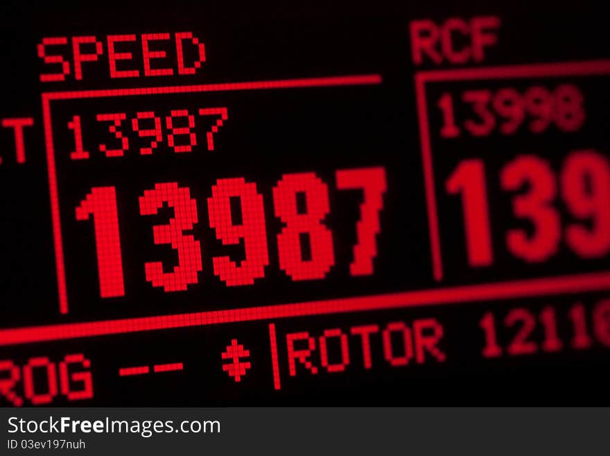 LCD red display of scientific centrifuge showing rotor speed. LCD red display of scientific centrifuge showing rotor speed