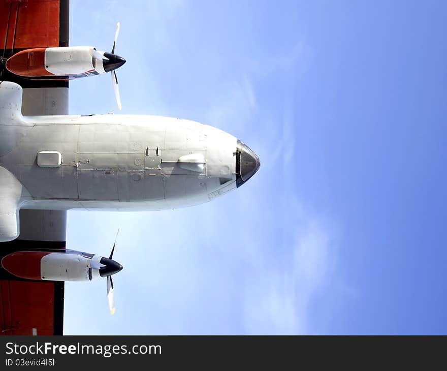 Fuselage and the two engine aircraft against the sky. Fuselage and the two engine aircraft against the sky