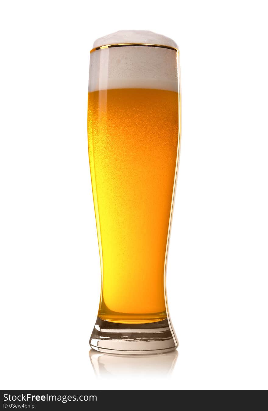 Beer into glass isolated on white. Beer into glass isolated on white